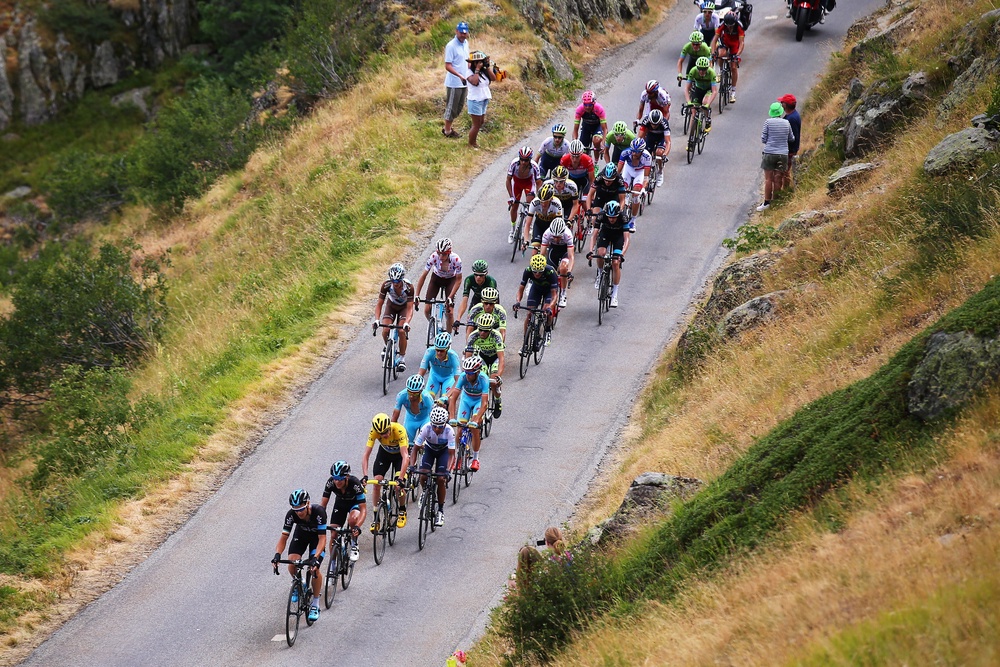 The Tour de France cuts through the Alpine countryside (Getty)