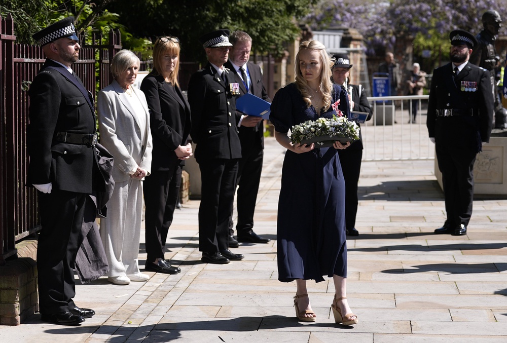 Andrew Harper’s widow Lissie Harper lays a wreath at a memorial stone in Reading dedicated to his memory (Andrew Matthews/PA) (PA Wire)