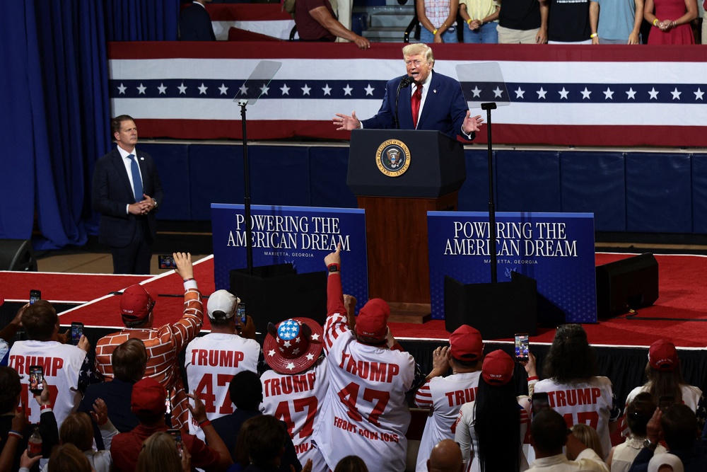 President Donald Trump hails his loyal ‘Front Row Joes’ at Georgia rally but one ex-member felt patronized (Reuters)