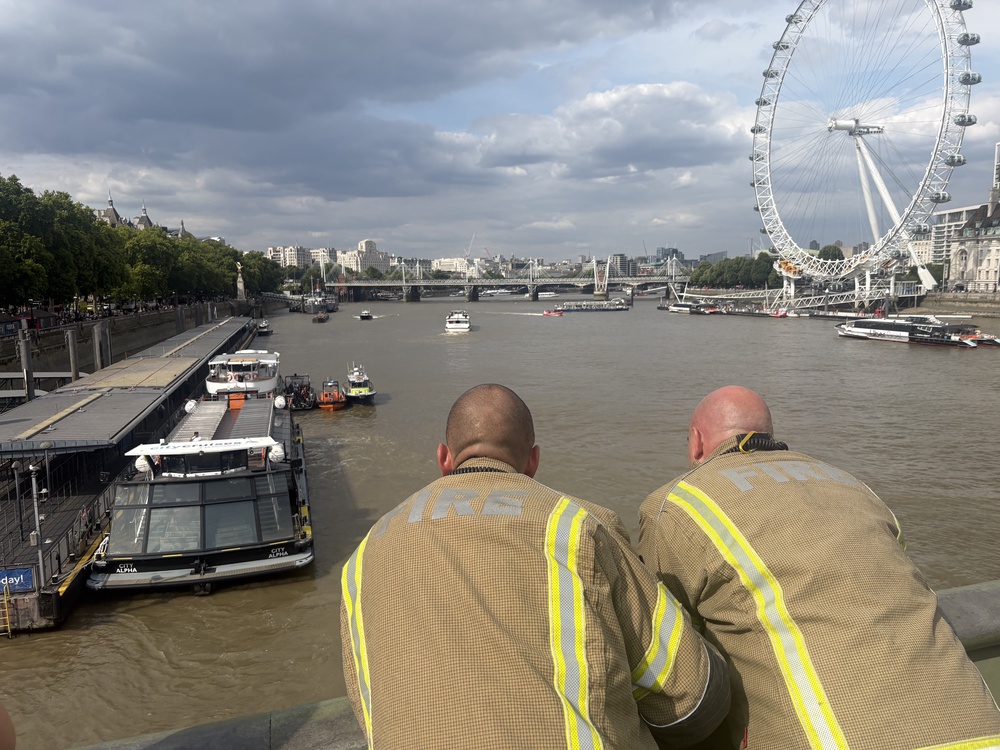 Fire crews overlook the river after the incident (George Lithgow/PA) (PA Wire)
