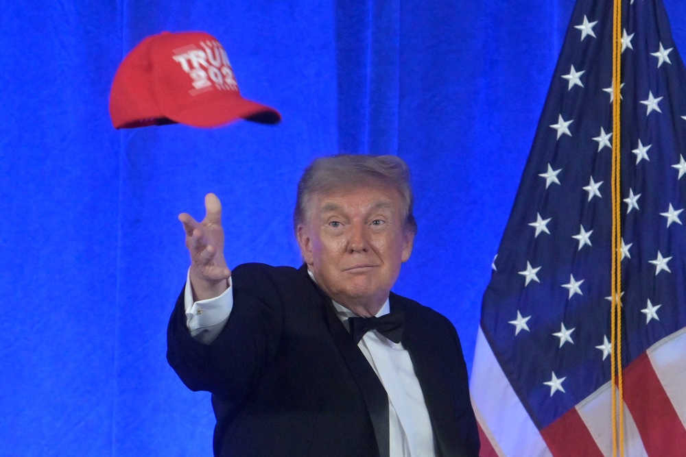Mr Trump threw the cap into the crowd at the end of his speech (Rod Lamkey Jr/AP) (AP)