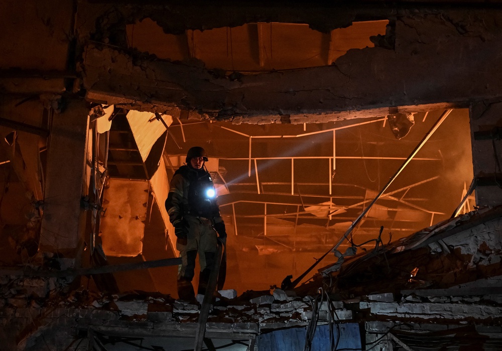 A rescuer works at a site of the central market hit by Russian drone strike, amid Russia's attack on Ukraine, in Zaporizhzhia, Ukraine July 25, 2026. REUTERS/Stringer (Reuters)
