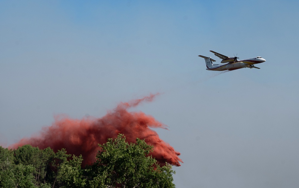 A water bomber fighting wildfires In Ares, western France (Caroline Blumberg/AP)