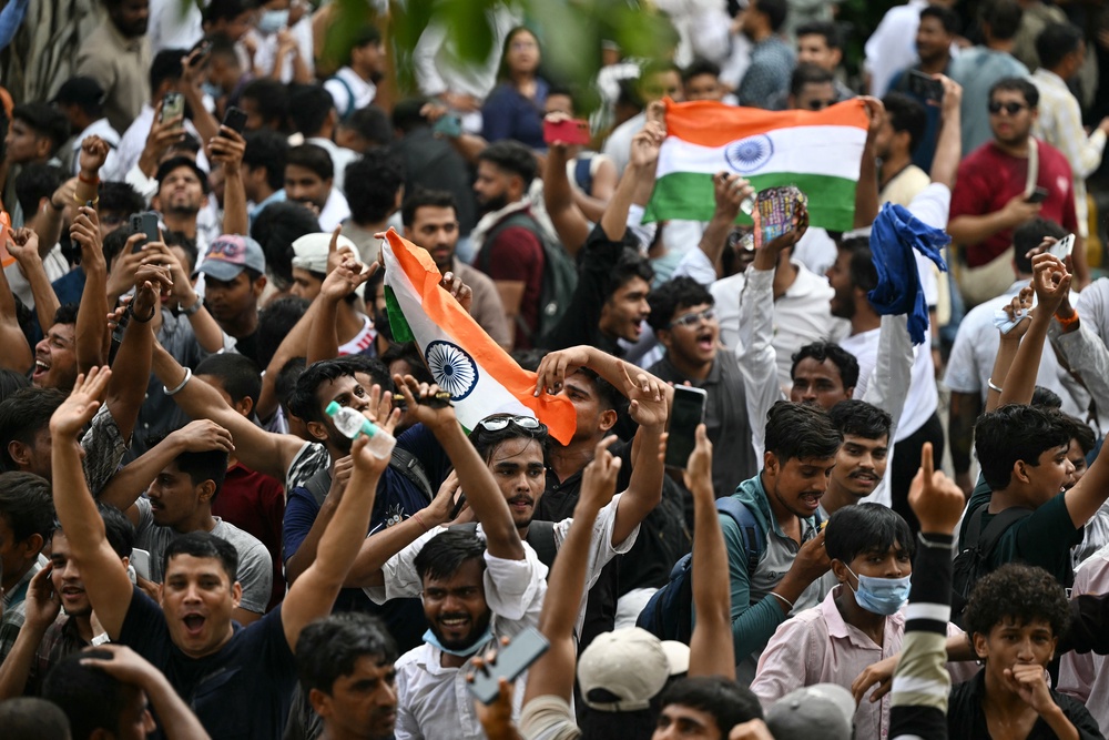 Cockroach Janta Party (CJP) supporters celebrate the resignation of India’s Education Minister Dharmendra Pradhan, at Jantar Mantar in New Delhi on 25 July 2026 (AFP/Getty)