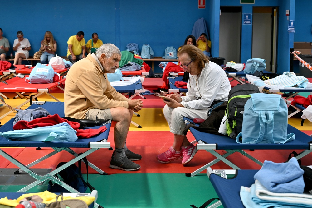 Elderly persons evacuated amid wildfires rest in a sports hall in Villaviciosa de Odon, 20 kms west of Madrid, on July 25, 2026. (AFP/Getty)