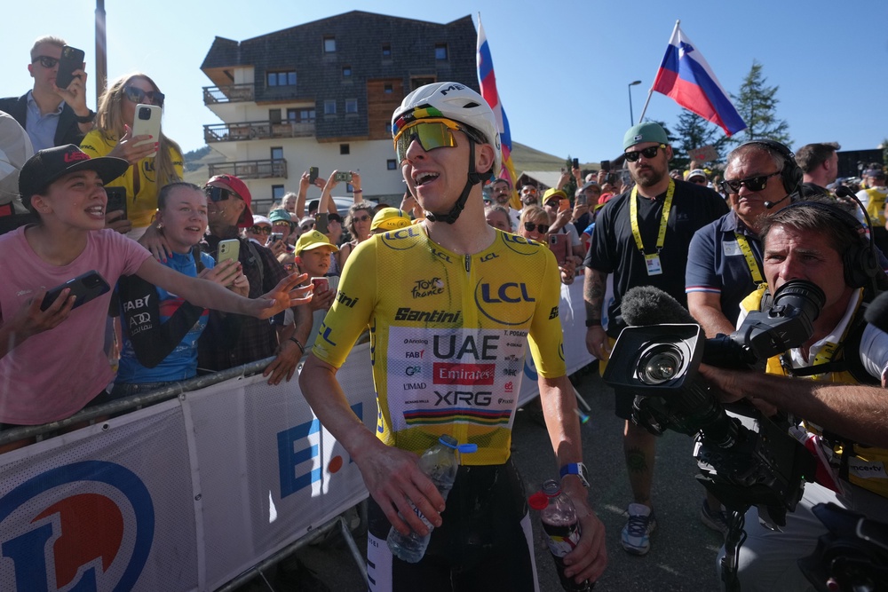 Tadej Pogacar celebrates wining stage 19 of the Tour de France (AP)