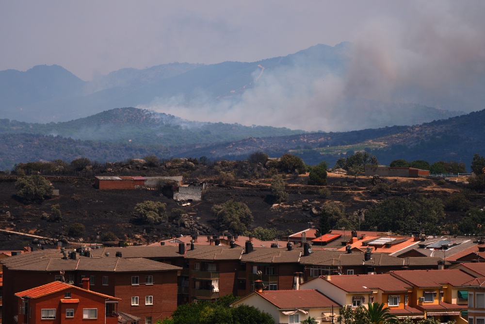 Smoke rises as a wildfire advances near El Tiemblo, Madrid province, Spain (AP)