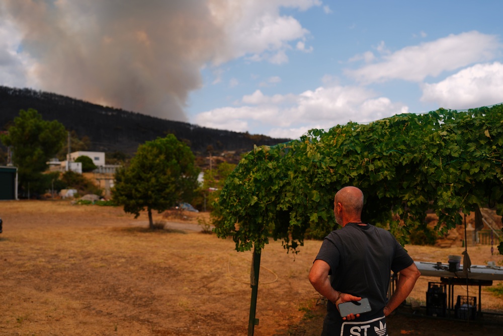 Alberto Garcia watches as a wildfire advances near El Tiemblo, Madrid province, Spain (AP)