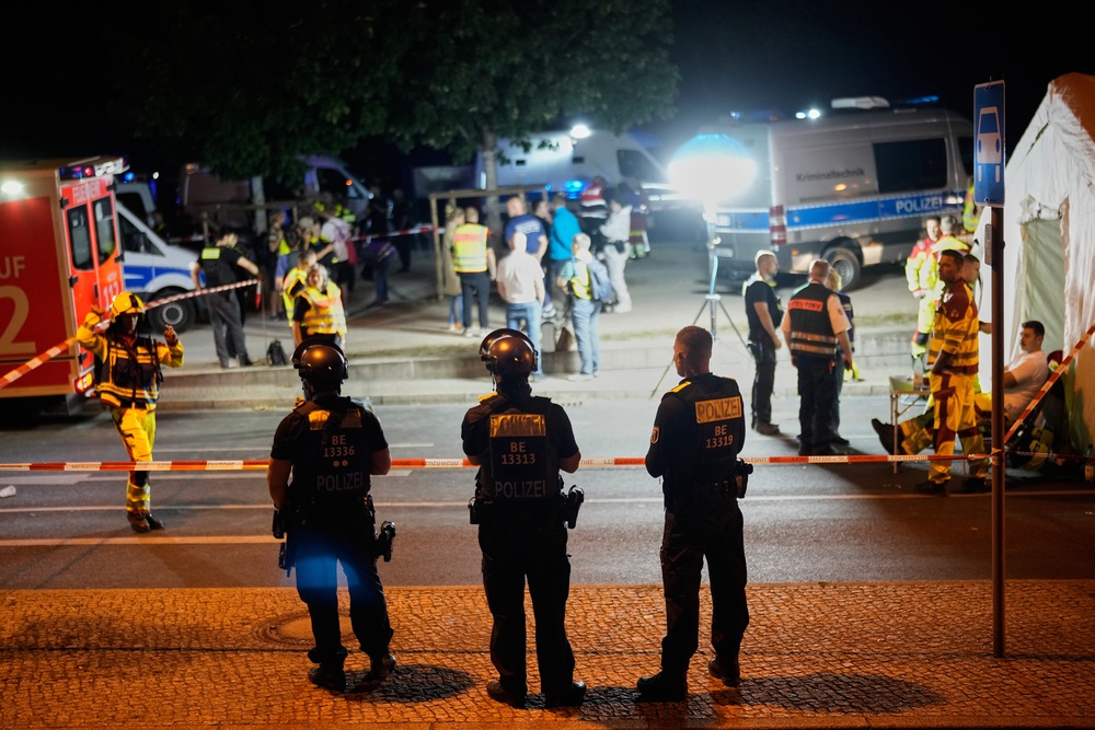 Emergency personnel and police gather in Berlin, early Sunday, 26 July 2026 (AP)