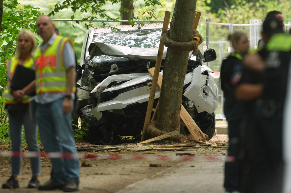 A wrecked vehicle at the scene of the attack (AP)