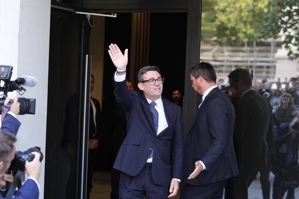 Andy Burnham comes out of No 10 North in Heron House, central Manchester, to greet a crowd after holding a meeting (Peter Byrne/PA) (PA Wire)