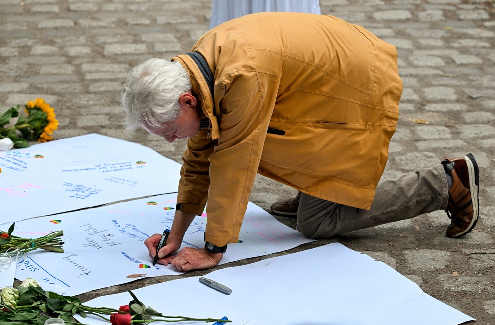 People have left flowers and messages of support at the scene of the attack (AFP/Getty)