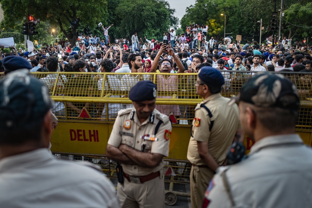 Armed forces enforce movement restrictions of celebrating demonstrators of India's Cockroach Janta Party (CJP), after days demanding the resignation of education minister Dharmendra Pradhan (Getty)