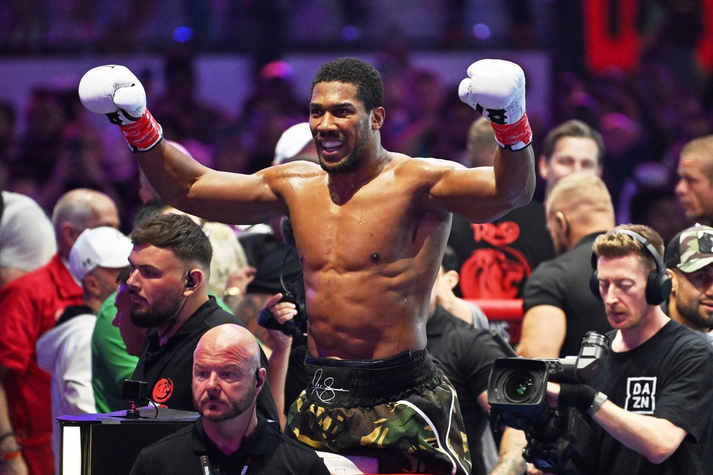 Joshua leant on his heart - but a showdown with Fury still has hurdles to overcome (AP)