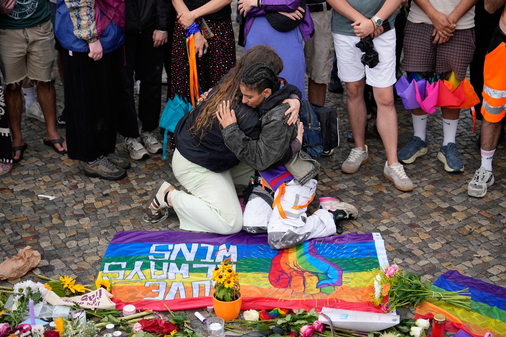Crowds gathered outside Brandenburg Gate for a demonstration in support of the LGBTQ+ community (AP)