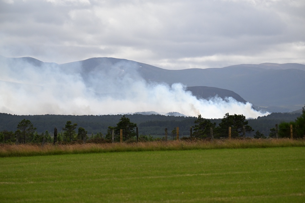 Smoke rises from the wildfire in the Cairngorms National Park that has been burning for 12 days (Michal Wachucik/PA) (PA Wire)