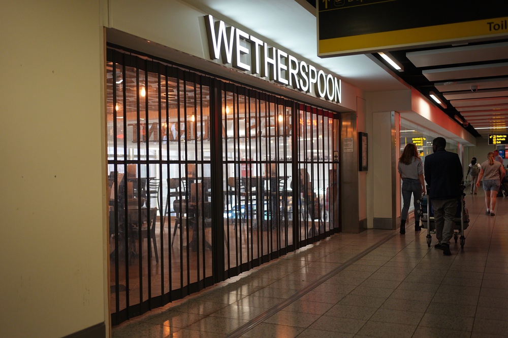 Shutters were down on the entrance to the Wetherspoon pub (Aaron Chown/PA) (PA Wire)
