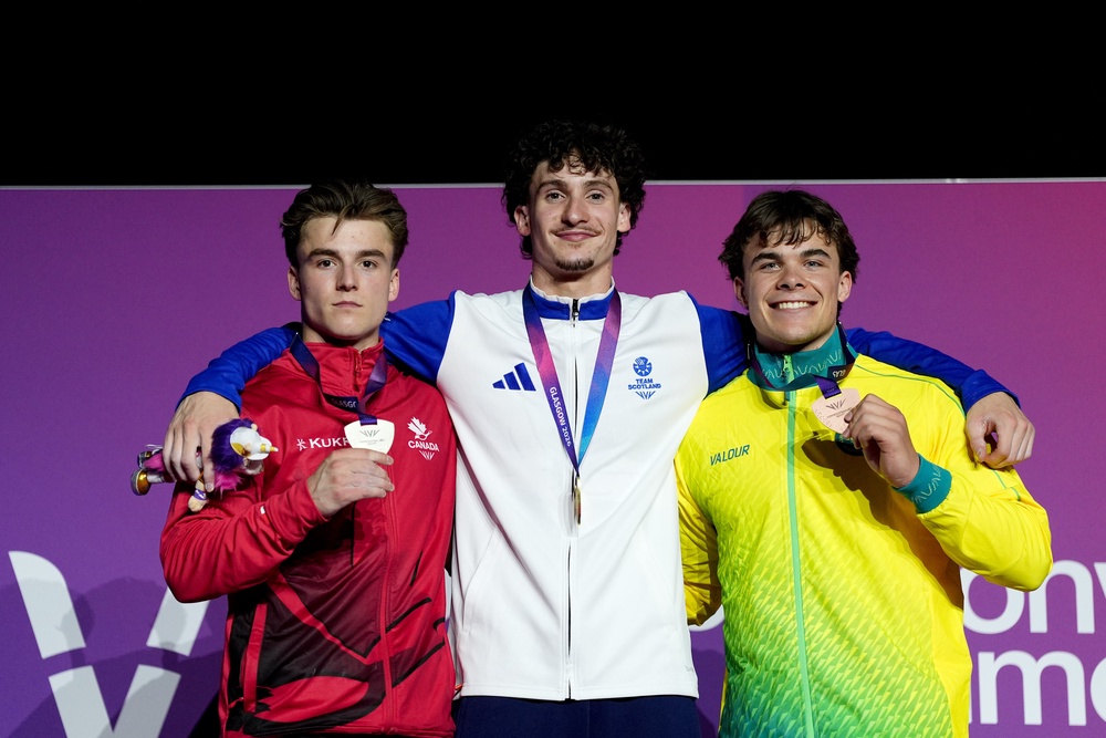 The all-around medallists celebrate on the podium (PA)