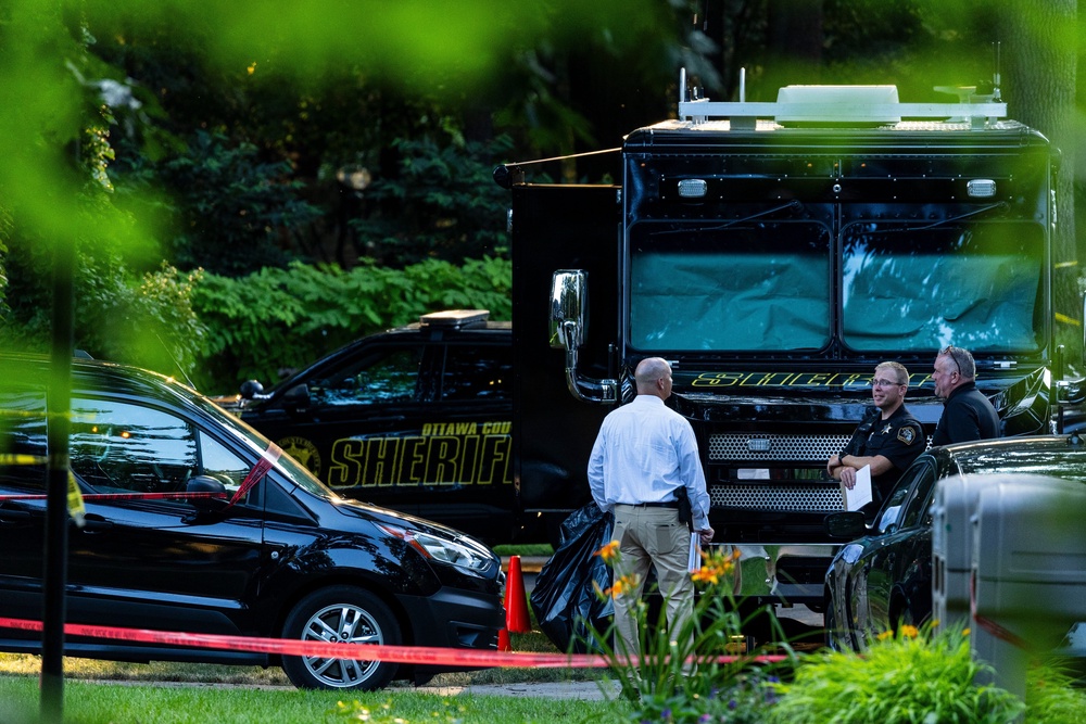 The couple’s six children, between the ages of 5 and 15, were found with gunshot wounds inside the home that had been set on fire (AP)
