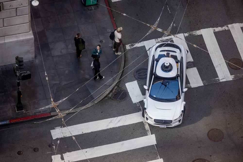 High angle view of an Alphabet's Waymo self-driving car in downtown San Francisco on Bush and Sansome Streets as it drives and transports passengers (Getty/iStock)