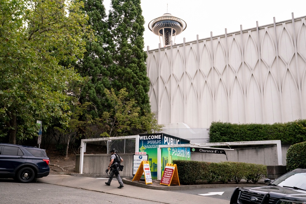 A police officer walks on patrol after a mass shooting at the Bite of Seattle food festival on 26 July 2026 in Seattle, Washington (Getty)