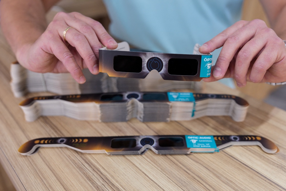 A man holds eclipse-viewing glasses that are certified to the ISO 12312-2:2015 international safety standard (AFP/Getty)