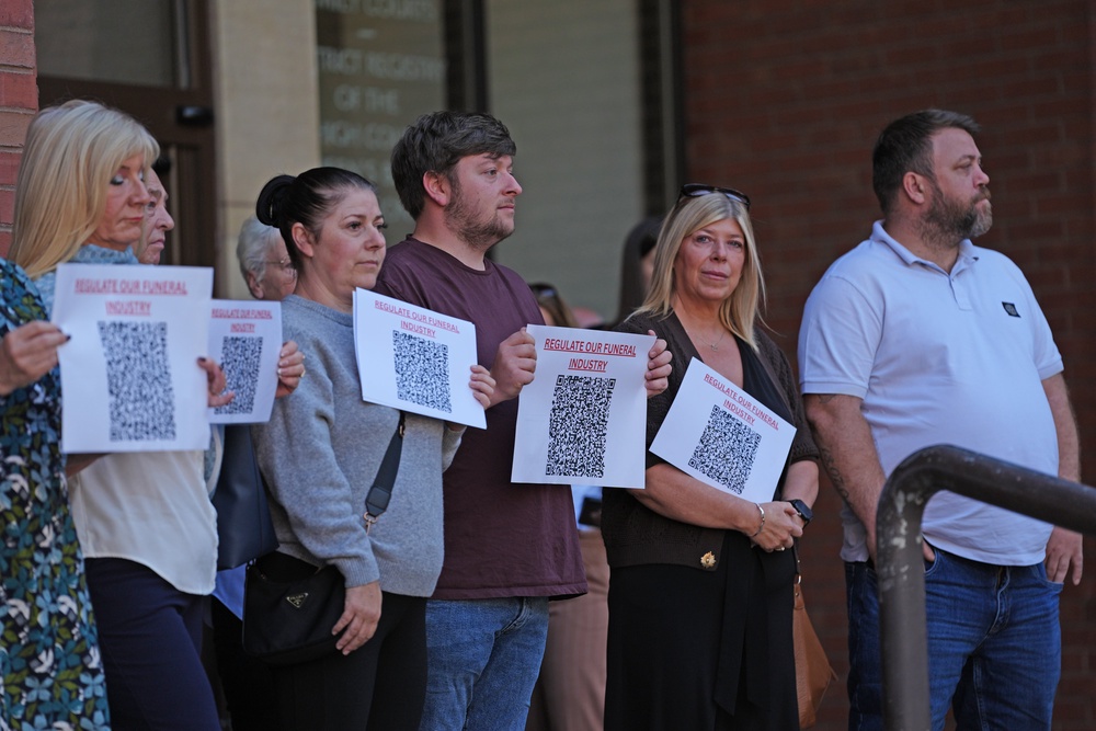 People demonstrate outside Hull Crown Court ahead of Bush’s sentencing (PA)