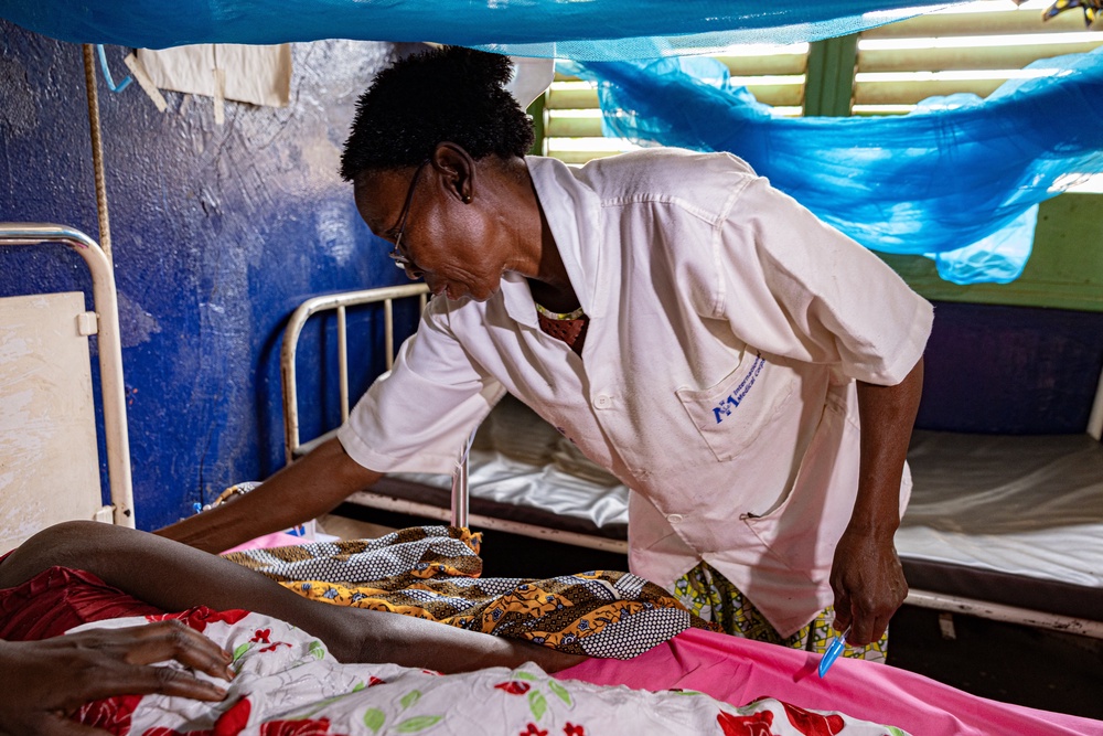 Delphine Zanaba, a nurse, tends to a mother who just lost her baby at nine months and nearly died herself (Bel Trew)