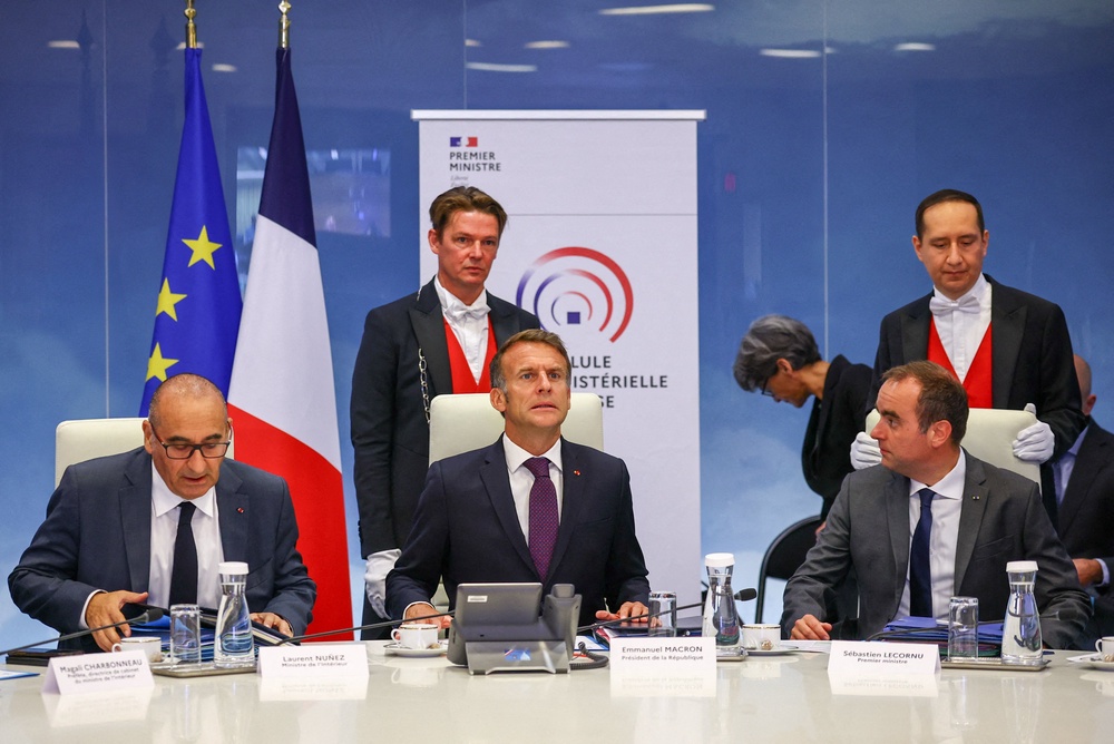 France's President Emmanuel Macron (C), France's Prime Minister Sebastien Lecornu (R), France's Interior Minister Laurent Nunez (L) attend a meeting with other members of the cabinet to discuss wildfires in the country, at the Hotel de Beauvau, the French Interior Ministry, in Paris on July 27, 2026. (AFP/Getty)