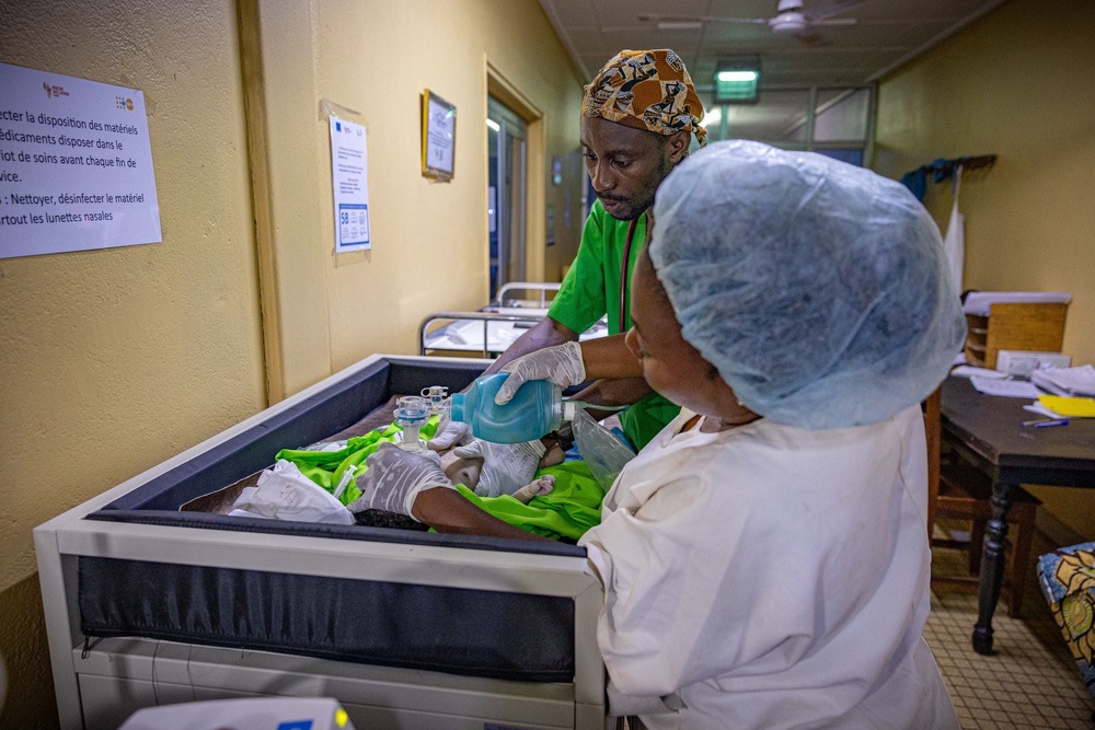 Doctors try to save a newborn’s life after she is brought in on a motorcycle to the CAR’s only paediatric hospital (Bel Trew)