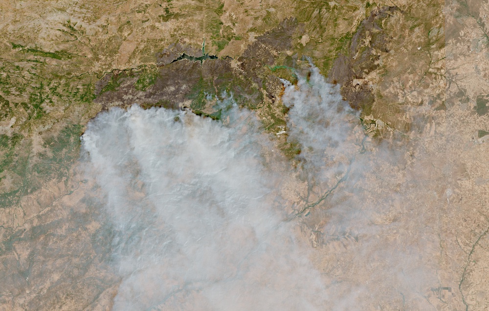 A satellite image shows smoke rising from large wildfires over the Castilla and Leon region, north of Madrid, drifting southwards over the Castilla-La Mancha region, in Spain, July 26, 2026 in this handout image obtained by Reuters on July 27, 2026. (Reuters)