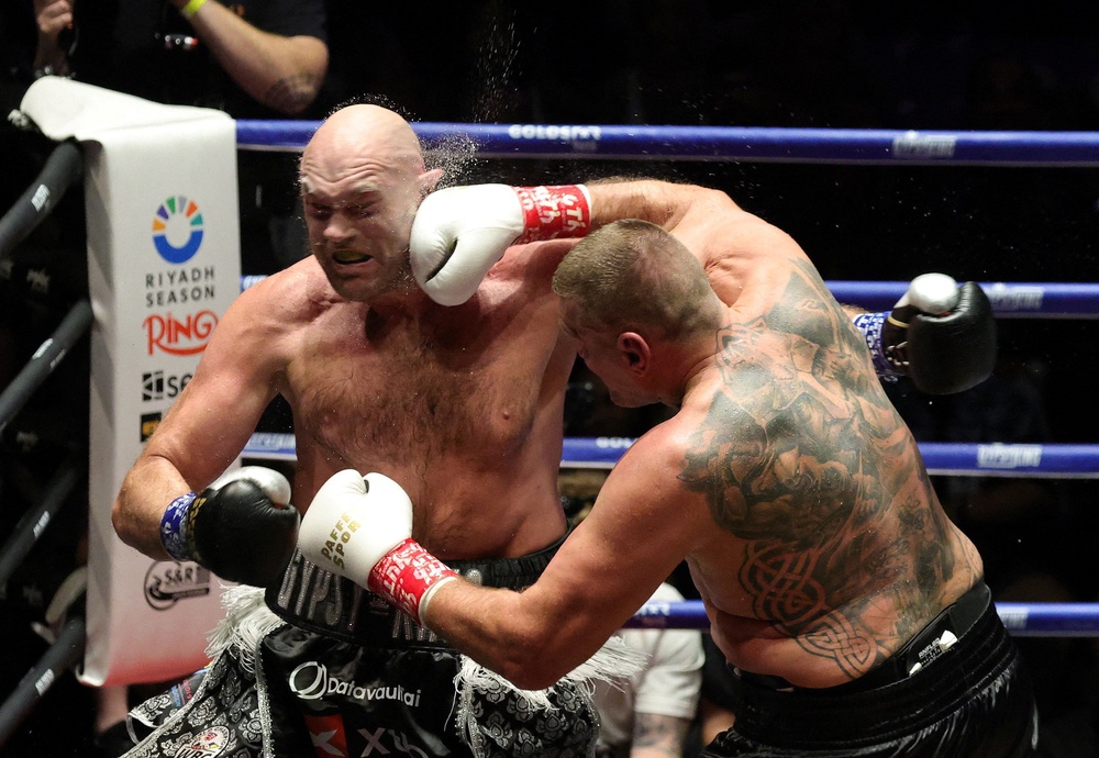 Tyson Fury (left) failed to impress against Mariusz Wach (Reuters)