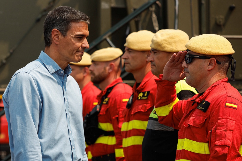 The Prime Minister has met with members of emergency services during his visit to Castellon, an area affected by wildfire (Reuters)