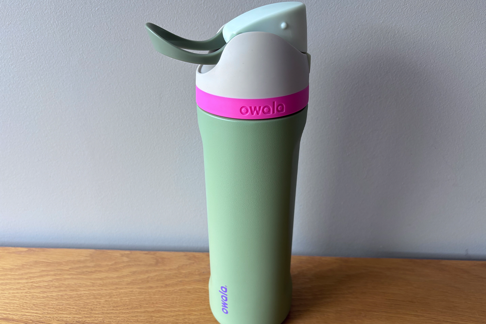 It opens with a single press and the carry handle locks over the button so it won’t open accidentally (Siobhan Grogan/The Independent)