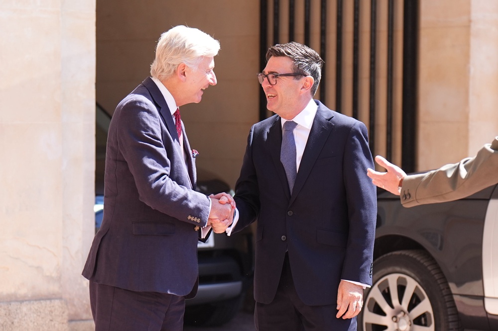 Sir Clive Alderton (left), principal private secretary to the King and Queen, pictured greeting Andy Burnham as he arrived at Buckingham Palace to be appointed prime minister by the King (Aaron Chown/PA) (PA Wire)