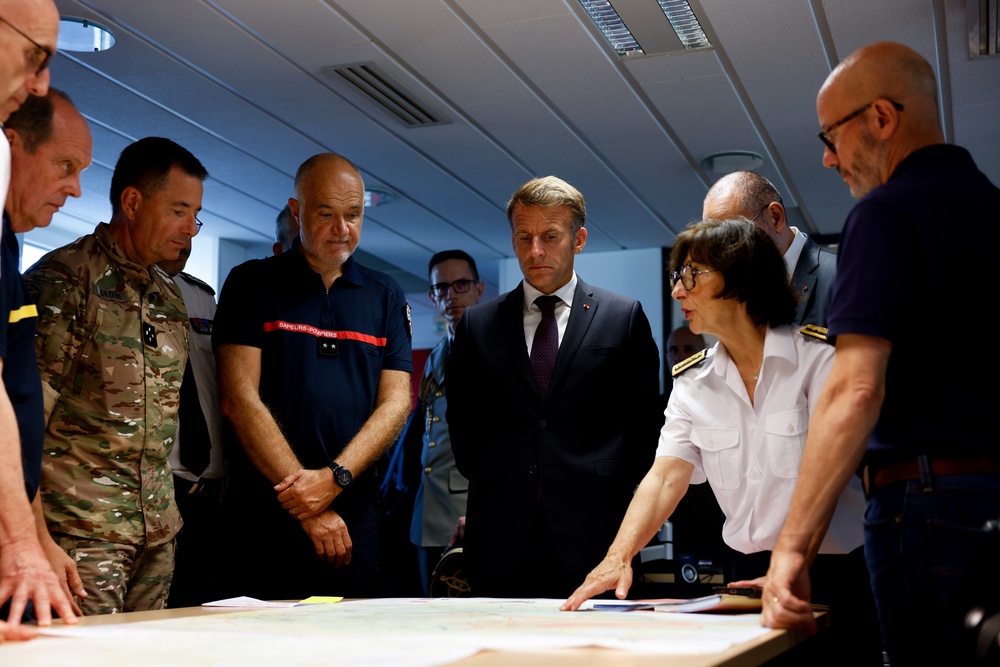 Emmanuel Macron during a situation briefing in the crisis room at the Departmental Fire and Rescue Operational Centre in Bordeaux on Monday (AP)