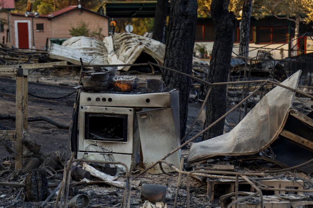 Camping La Ardilla Roja is burnt out next to Pantano de San Juan following wildfires (Getty)