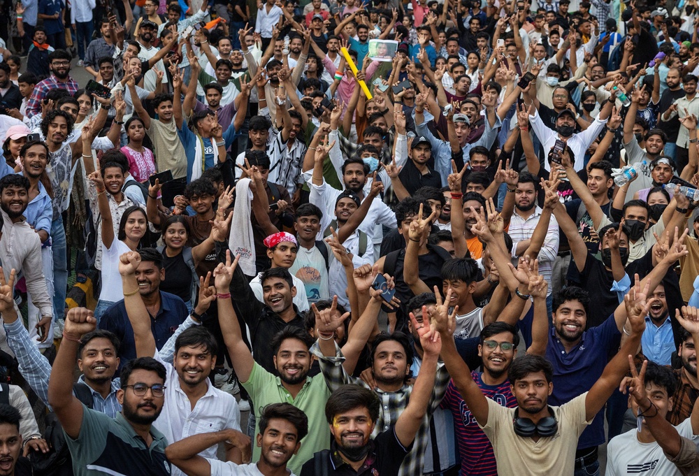Supporters of India's Cockroach Janta Party (CJP) celebrate after India's Education Minister Dharmendra Pradhan resigned following days of protests (Reuters)