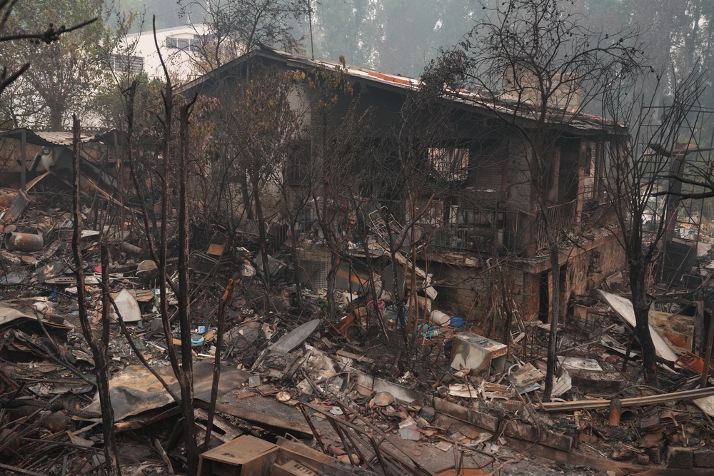 A house destroyed by a wildfire is photographed as the fire continues to spread in Pelayos de la Presa, Madrid province, Tuesday, July 28, 2026. (AP Photo/Manu Fernandez) (AP)