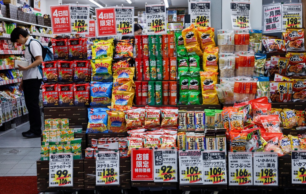 People shop for snacks at a confectionery store in Tokyo, Japan (Reuters)