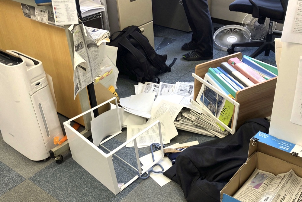Toppled shelving after an earthquake, with a preliminary magnitude of 7.1, struck Japan's southern Kumamoto prefecture (Reuters)