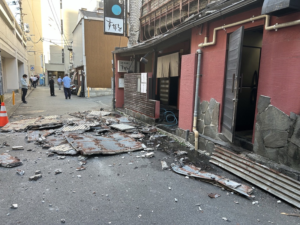 The exterior wall of a shop is seen collapsed in an earthquake, in Kumamoto City (AFP/Getty)