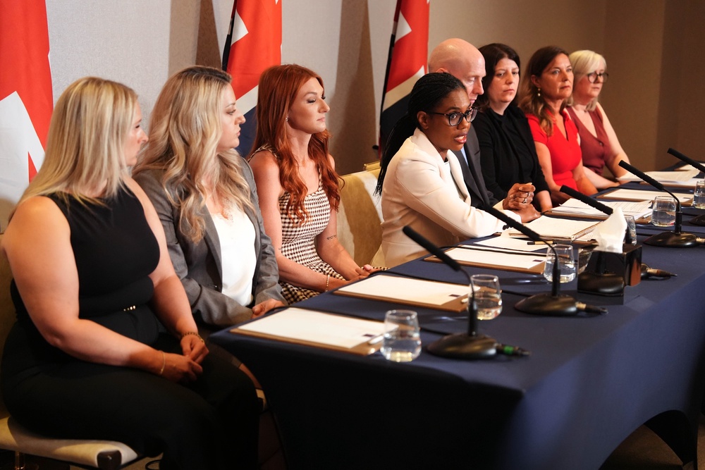 Kemi Badenoch held a press conference with survivors who had been told their abusers could be released early under the scheme in June (PA)