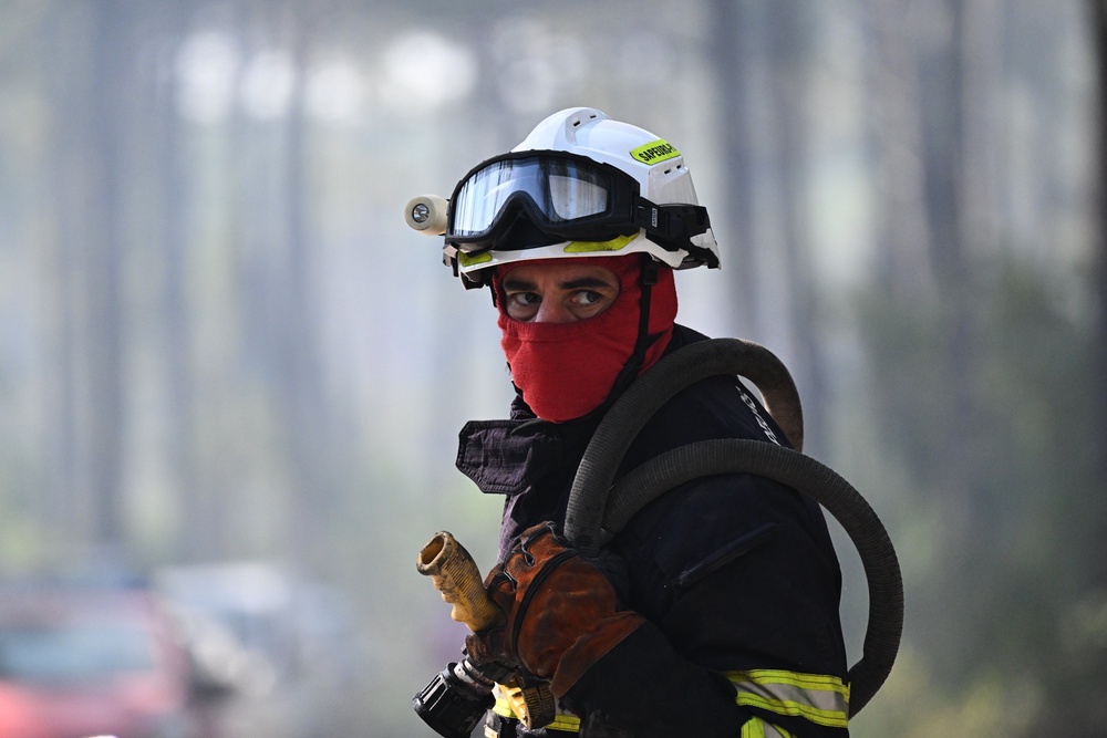Firefighters continue in efforts to suppress the blaze ahead of projected heatwave (AP)