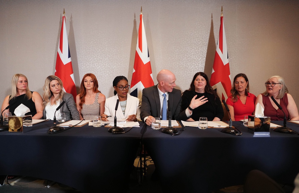 (Left to right) Marie Stone, Kayleigh Corbin, Jade Belgrove, Conservative Party leader Kemi Badenoch, shadow justice minister Kieran Mullan, Sarah Wilson, Carol Higgins, and Vicki Crawford during a press conference (PA) (PA Wire)