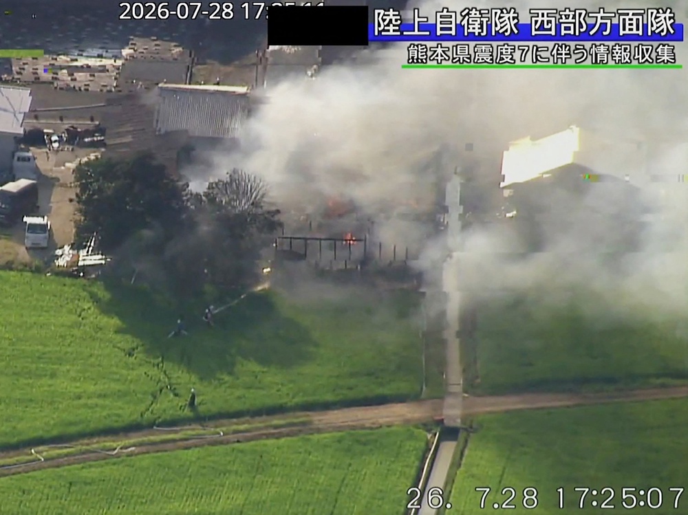 A building with smoke rising from it after an earthquake in Uki City, Kumamoto Prefecture (AFP/Getty)