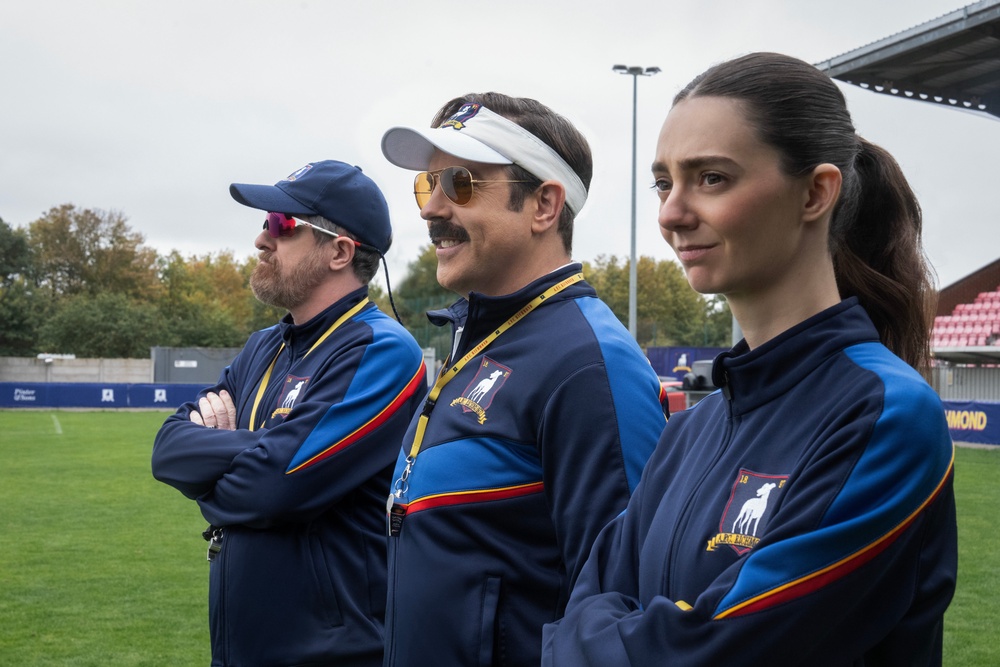 Jason Sudeikis (middle) leads ‘Ted Lasso’ as an exceptionally cheery soccer coach (Apple TV+)
