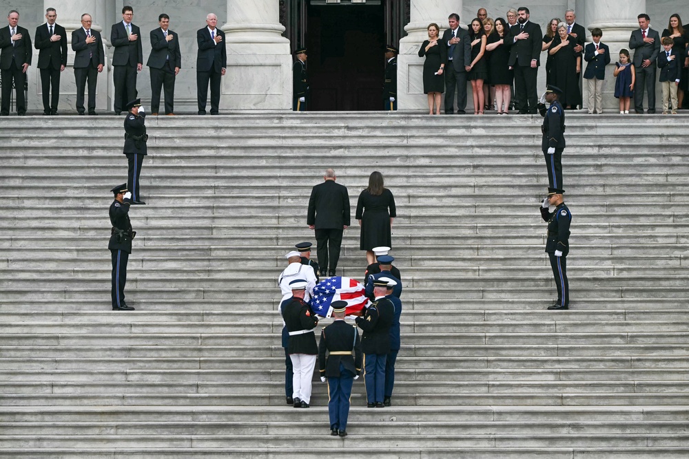 A US military honor guard carries the casket of the late US Senator Lindsey Graham upon arrival for a Congressional tribute to Graham at the US Capitol (AFP via Getty Images)