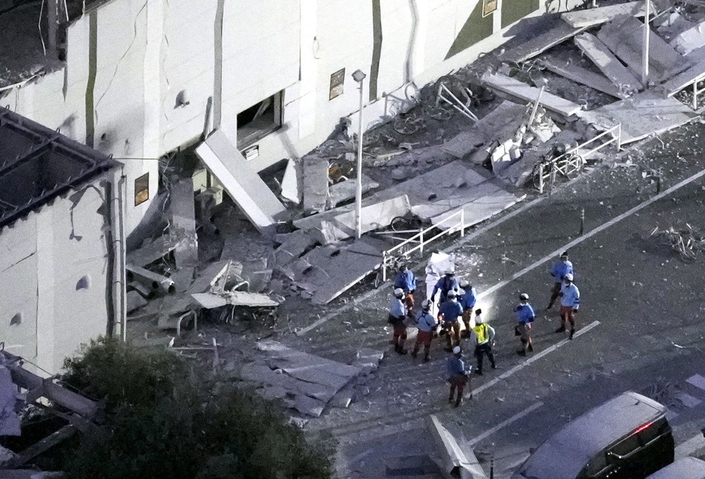 Rescue workers conduct a search and rescue operation at the damaged shopping mall (Reuters)