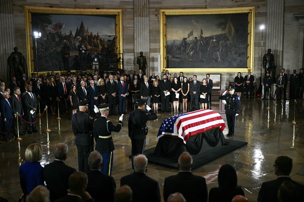 A military honor guard salutes during a Congressional tribute to late US Senator Lindsey Graham (AFP via Getty Images)